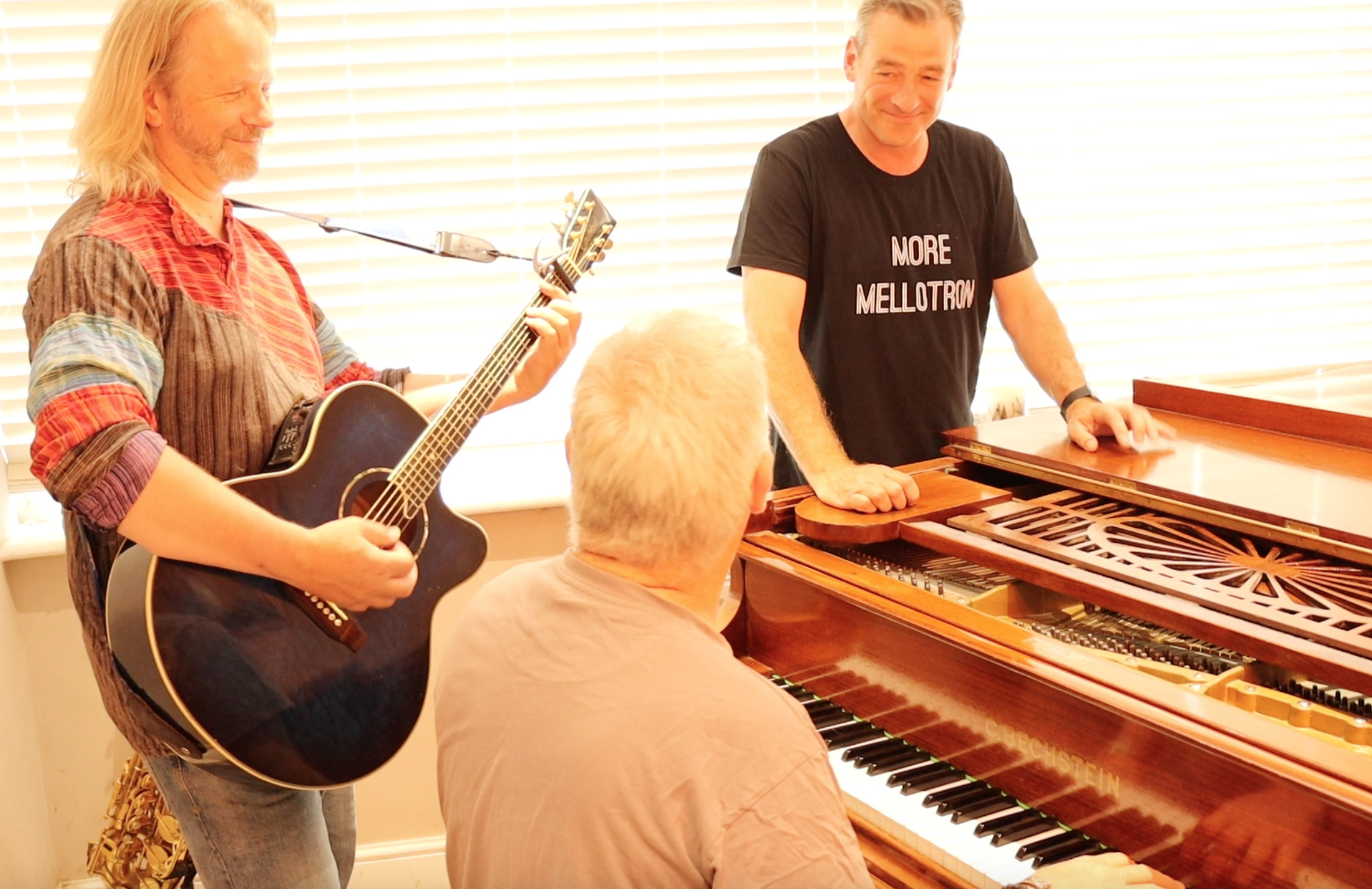 Dave, Neil and Benj around piano